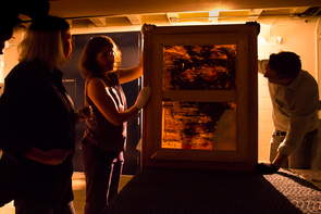 The examination of "Woman-Ochre" involved the inspection of the canvas for structural weaknesses. (Photo: Bob Demers/UANews) The examination of "Woman-Ochre" involved the inspection of the canvas for structural weaknesses. (Photo: Bob Demers/UANews)